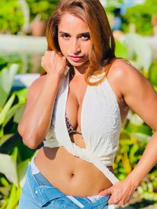 Pooja Bhalekar posing in leopard print and denim resort wear outfit