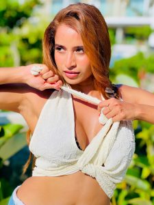 Pooja Bhalekar posing in leopard print and denim resort wear outfit