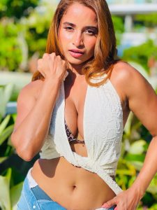 Pooja Bhalekar posing in leopard print and denim resort wear outfit