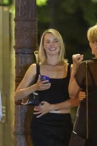 Margot Robbie Black Midi Skirt Look in Paris – August 15, 2026 34 Margot Robbie Black Midi Skirt Look in Paris – August 15, 2026
