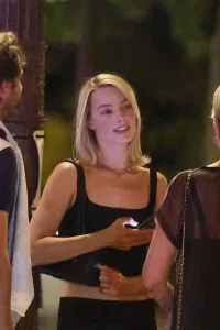 Margot Robbie Black Midi Skirt Look in Paris – August 15, 2026 33 Margot Robbie Black Midi Skirt Look in Paris – August 15, 2026