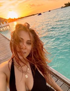 Nia Sharma’s Maldives Vacation Dump Is the Ultimate Moodboard for Luxury, Sunsets and Seafood 25 Nia Sharma posing against the turquoise waters and wooden boardwalks of the Maldives