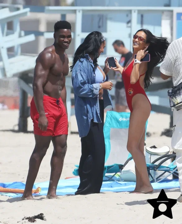 shay-mitchell-films-baywatch-in-a-red-swimsuit-july-2026-8 Shay Mitchell Films Baywatch in a Red Swimsuit July 2026